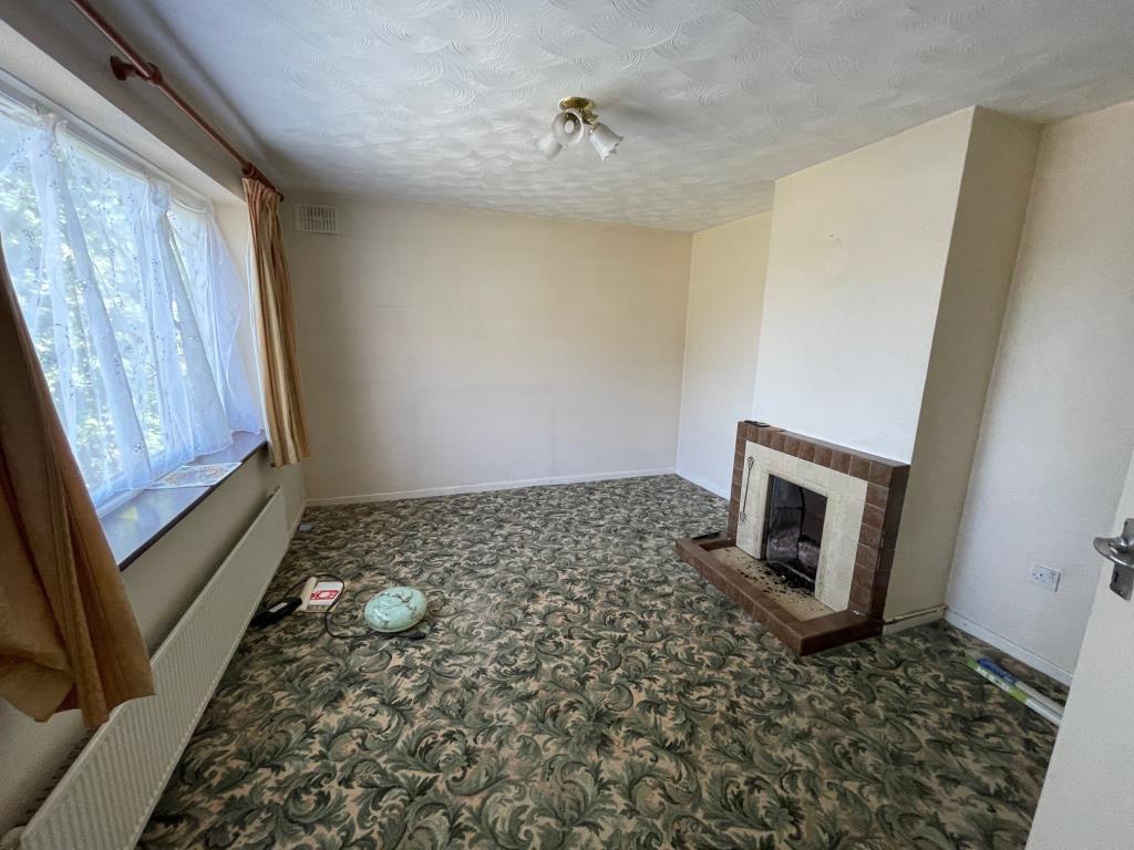 Lot: 11 - SEMI-DETACHED HOUSE FOR IMPROVEMENT AND REPAIR - Living room with window to front and fireplace